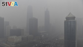 Beijing's Central Business District area is hidden in heavy air pollution during a 