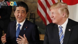 U.S. President Donald Trump and Japan's Prime Minister Shinzo Abe speaks while dining at Trump's Mar-a-Lago estate. (April 18, 2018)