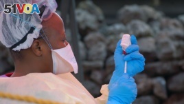 A nurse prepares a vaccine against Ebola in Goma on August 7, 2019. Three cases of the deadly virus was detected in the border city of Goma, the Congolese presidency said on August 1, 2019. / AFP / Augustin WAMENYA