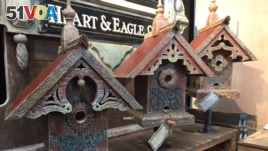 Artisan John Guertin combines his love of architecture and the environment by creating one-of-a-kind birdhouses and feeders using wood from century-old barns from his home state of Michigan.