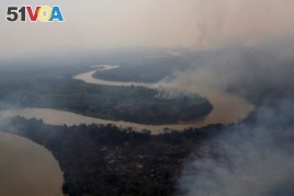 An aerial view shows smoke rising into the air around the Cuiaba river in the Pantanal, the world's largest wetland, in Pocone, Mato Grosso state, Brazil, August 28, 2020. REUTERS/Amanda Perobelli