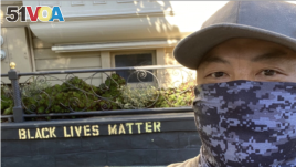 James Juanillo stands in front of his home in San Francisco.