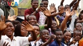 People react as Pope Francis arrives to start his apostolic journey, in Kinshasa, Democratic Republic of Congo, January 31, 2023. (REUTERS/Yara Nardi)