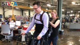 Patrick Wensing tests out an Ekso Bionics exoskeleton in his lab at the University of Notre Dame. He and his team are working to make the machines more intuitive. (Photo: Notre Dame)