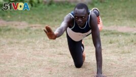 FILE - Paulo Amotun Lokoro, a refugee from South Sudan, part of the refugee athletes who qualified for the 2016 Rio Olympics, stretches during a training session in Ngong township near Kenya's capital Nairobi, June 9, 2016.