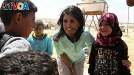 U.S. Ambassador to the United Nations Nikki Haley, speaks with Syrian refugee children, during a visit to the Zaatari Refugee Camp, Jordan, May 21, 2017. 