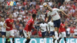 Tottenham's Harry Kane heads the ball during the English FA Cup semifinal soccer match between Manchester United and Tottenham Hotspur at Wembley stadium in London, Saturday, April 21, 2018. (AP Photo/Kirsty Wigglesworth)