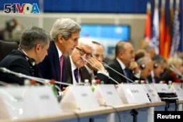 U.S. Secretary of State John Kerry (2nd L) delivers remarks to the OSCE Ministerial Council meeting in Belgrade, Serbia, Dec. 3, 2015.