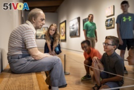 School children look at art at the Crystal Bridges Museum of American Art, Bentonville, Arkansas