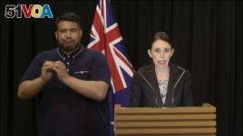 In this image made from video, New Zealand's Prime Minister Jacinda Ardern, right, speaks during a press conference in Wellington, Thursday, March 21, 2019.