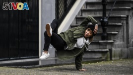 B-Girl Ayumi is a teacher by day but a world-class breakdancer by night. She poses here on October 31st 2017 (Little Shao/Red Bull Content Pool via AP Images)