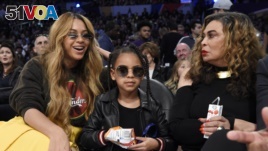 Singer Beyonce, left, with her daughter Blue Ivy Carter, center, and her mother Tina Knowles February 18, 2018, in Los Angeles. Experts say gender neutral names, like Blue, Riley, River and<I>&#</I>13;<I>&#</I>10;and Justice to name their children. (AP Photo/Chris Pizzello)
