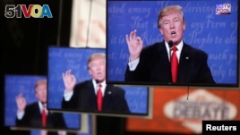 Republican U.S. presidential nominee Donald Trump is shown on TV monitors in the media filing room on the campus of University of Nevada, Las Vegas, during the last 2016 U.S. presidential debate in Las Vegas, U.S., Oct. 19, 2016.