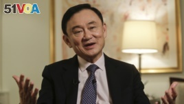In this March 9, 2016 file photo, Thailand's former Prime Minister Thaksin Shinawatra responds to questions during a news interview in New York. (AP Photo/Frank Franklin II, File)