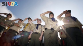 In this Saturday morning, May 21, 2011 file photo, Boy Scouts salute during a 