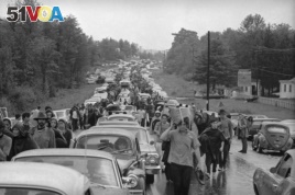 FILE - In this Aug. 16, 1969 file photo, hundreds of rock music fans jam a highway leading from Bethel, New York, as they try to leave the Woodstock Music and Art Festival.