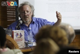 FILE - U.S writer Peter Kornbluh speaks to an audience about 