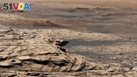 This photo, compiled from 28 images, shows the view from NASA's Curiosity Mars rover on April 9, 2020. It shows the landscape of the Stimson sandstone formation in Gale Crater. (Photo Credit: NASA/JPL-Caltech/MSSS)