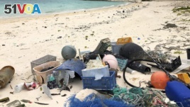 In this Oct. 22, 2019, photo, plastic and other marine debris sits on the beach on Midway Atoll in the Northwestern Hawaiian Islands. (AP Photo/Caleb Jones)