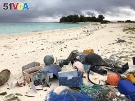 In this Oct. 22, 2019, photo, plastic and other marine debris sits on the beach on Midway Atoll in the Northwestern Hawaiian Islands.