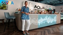 Roia Jabari, managing director of AQUA Water Bar by LUQEL poses at her store in Dubai, United Arab Emirates on July 11, 2023. (AP Photo/Kamran Jebreili)