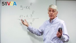 FILE - Teacher Jerry Howland explains an equation during the Bridge to Calculus summer program at Northeastern University in Boston on Tuesday, Aug. 1, 2023. (AP Photo/Reba Saldanha)