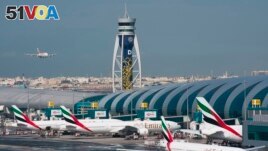 In this file photo, an Emirates jetliner comes in for landing at Dubai International Airport in Dubai, United Arab Emirates, Dec. 11, 2019. (AP Photo/Jon Gambrell, File)