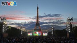 FILE - Fans watch the Euro 2016 final soccer match between Portugal and France in Paris, France, July 10, 2016. (AP Photo/Francois Mori)
