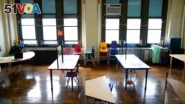 FILE - Desks are spaced apart ahead of planned in-person learning at an elementary school on March 19, 2021, in Philadelphia. Students across the United States have had 