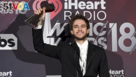 Zedd poses in the press room with the award for dance song of the year for 