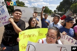 Illegal and legal immigrants who live in the U.S. of states Maryland and Virginia gather outside the White House in Washington, D.C. to show their support of President Obama's immigration policies, June 2012. (AP Photo/Jacquelyn Martin)