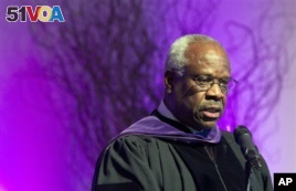  In this Jan. 26, 2012 file photo, Supreme Court Justice Clarence Thomas speaks at College of the Holy Cross in Worcester, Mass. Thomas has asked questions during Supreme Court arguments for the first time in 10 years. Thomas' question came Monday, Feb. 29, 2016. (AP Photo/Michael Dwyer, File)