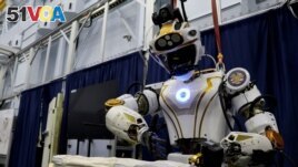 NASA's humanoid robot Valkyrie opens a bag at the Johnson Space Center in Houston, Texas, U.S., November 16, 2023. (REUTERS/Evan Garcia)