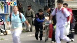 Rescuers and medical officers push an injured person on a gurney at the site of a bomb blast in Hua Hin, south of Bangkok, Thailand, in this still image taken from video, August 12, 2016.