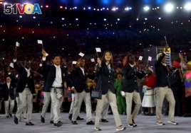 The refugee Olympic team arrives at the Opening Ceremony of the Rio Olympics.