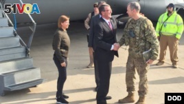 U.S. Defense Secretary Ash Carter greets Army Lieutenant General Sean MacFarland after arriving in Baghdad, December 16, 2015. 