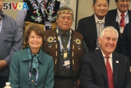 U.S. Secretary of State Rex Tillerson (seated right) and U.S. Sen. Lisa Murkowski pose with Nulato Chief Mickey Stickman at an Arctic Council event in Fairbanks, Alaska.