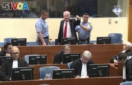 FILE - Bosnian Serb military chief Ratko Mladic during an angry outburst in the Yugoslav War Crimes Tribunal in The Hague, Netherlands, Nov. 22, 2017.