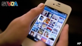 Instagram is demonstrated on an iPhone, in New York. (AP Photo/Karly Domb Sadof, File)