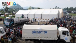 Internally displaced people (IDPs) await food distribution from the UNHCR. (File)