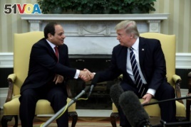 U.S. President Donald Trump and Egypt's President Abdel-Fattah el-Sissi shake hands in the Oval Office at the White House on April 3, 2017