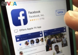 In this Monday, June 19, 2017, file photo, a user gets ready to launch Facebook on an iPhone, in North Andover, Mass. (AP Photo/Elise Amendola, File)