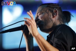 Thom York, lead singer of English rock band Radiohead, performs during their concert at the Optimus Alive music festival in Lisbon, Sunday, July 15 2012.  (AP Photo/Armando Franca) 