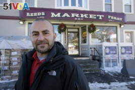 Sam Safa, of Merrimack, N.H., owner of Reeds Ferry Market, stands for a photograph outside the convenience store, Sunday, Jan. 7, 2018, in Merrimack.