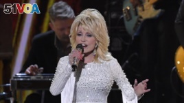 FILE - This Nov. 13, 2019 file photo shows Dolly Parton performing at the 53rd annual CMA Awards in Nashville, Tenn. Parton tweeted Wednesday, April 1, that she's donating $1 million to Vanderbilt University Medical Center in Nashville, Tennessee.