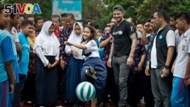 Usually students should not dillydally on the playground -- unless a famous soccer star visits. Here, former UNICEF Goodwill Ambassador David Beckham plays football with students and teachers at the SMPN 17 school in Semarang, Indonesia, March 27, 2018. (Photo UNICEF)