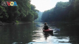 A person kayaks on the Green River