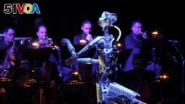A robot conductor leads an orchestra at the Sharjah Performing Arts Academy in Sharjah, United Arab Emirates, on January 31, 2020. (REUTERS/Satish Kumar)