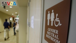 A sign marks the entrance to a gender-neutral bathroom at the University of Vermont in Burlington, Vermont.