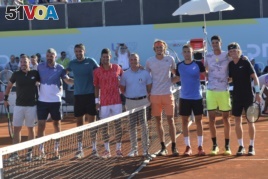 In this picture taken June 19, 2020, Serbian tennis player Novak Djokovic, fourth left, stands with other players at a tournament in Zadar, Croatia.